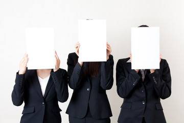 asian businesswomen holding a blank whiteboard