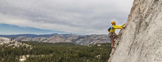 Foto op Aluminium Rock climber on the edge. © Greg Epperson