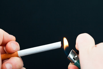 Someone lighting a cigarette