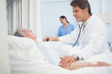 Fototapeta premium Doctor auscultating a patient