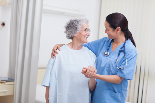 Nurse and a patient standing