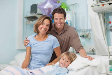 Fototapeta premium Parents next to their son