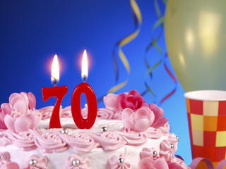 Birthday cake with red candles showing Nr. 70