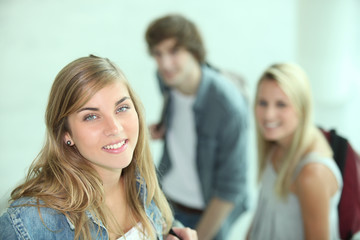 Three teenager going to class