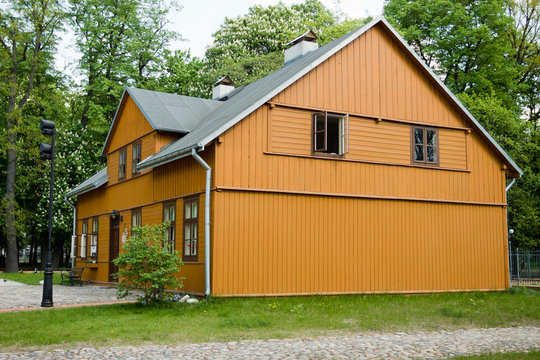 Fototapeta Green wooden house in Lodz