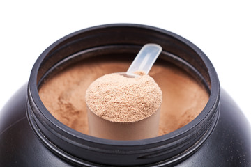 Scoop of chocolate whey isolate protein in black container