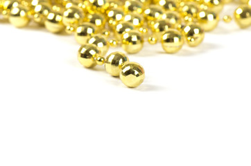 Background made of a brilliant celebratory beads of golden color