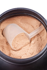 Scoop of chocolate whey isolate protein in black container