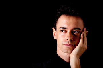 Young man portrait on dark background