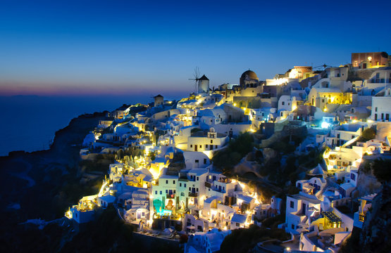 Oia village in Santorini at in the evening, Greece © great_photos