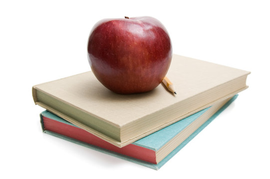 Apple On School Books Isolated On White