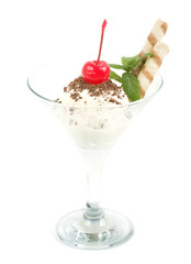 Dessert with cherry on a plate on background