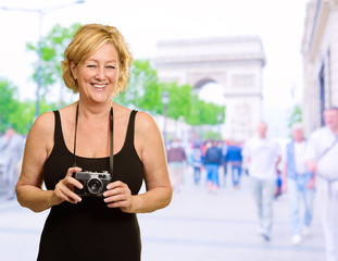 Woman Holding A Camera