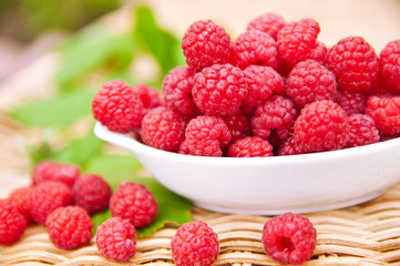 Raspberry in the white bowl