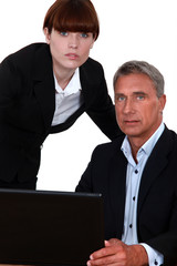 Fototapeta premium Business couple with a laptop