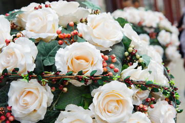Decorated creamy roses bouquet on the street