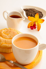 Breakfast wth bread and cup of milk tea.