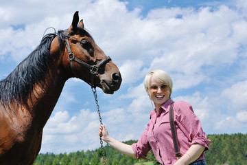 Obraz premium happy woman on horse