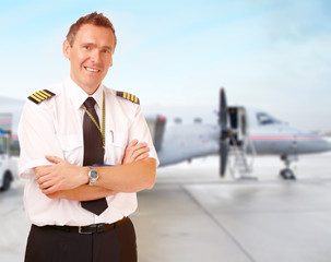 Airline pilot at the airport - obrazy, fototapety, plakaty