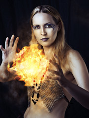dangerous woman witch with fire ball - obrazy, fototapety, plakaty
