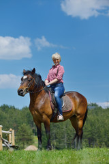 Fototapeta premium happy woman on horse