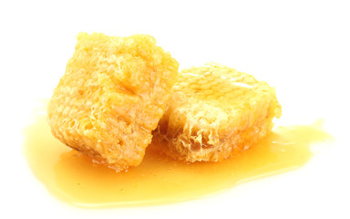 golden honeycombs with honey isolated on white.