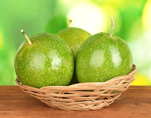 green passion fruit on green background