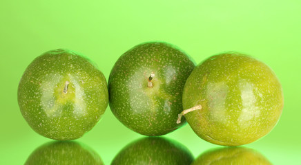 green passion fruit on green background close-up