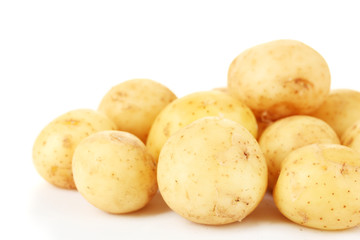 young potatoes on white background close-up