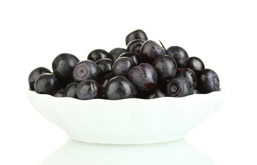 ripe blueberries in white bowl isolated on white