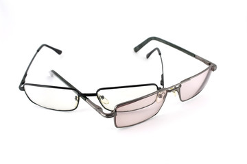 Two optical glasses over white