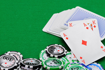 Gaming chips and cards on the green cloth