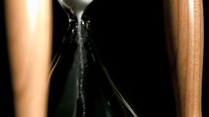 Hourglass in super slow motion containing sand