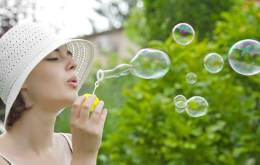 young girl with soap bubbles