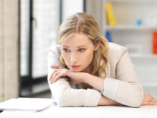 unhappy woman in office