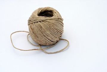 a ball of twine on white background, soft shadows