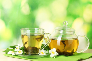 green tea with jasmine in cup and teapot