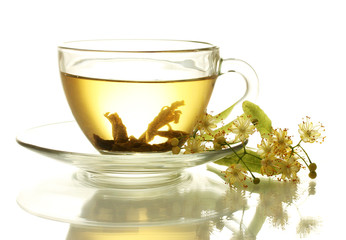 cup of linden tea and flowers isolated on white