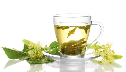 cup of linden tea and flowers isolated on white