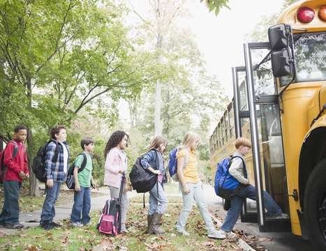 Children getting onto school bus