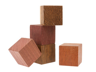 Several old cubes of wood, used by children for building