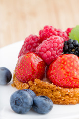 close up of fruit tart with berries