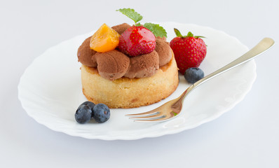 fresh fruit tart with berries on white background
