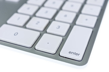 Modern aluminum computer keyboard isolated on white background