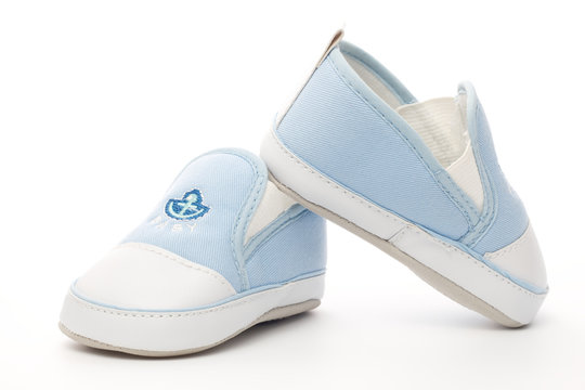 Little blue and white baby shoes with anchor logo