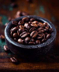 Espresso coffee beans in a stone pot
