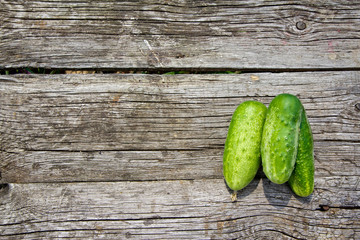 Cucumbers on the old wooden table