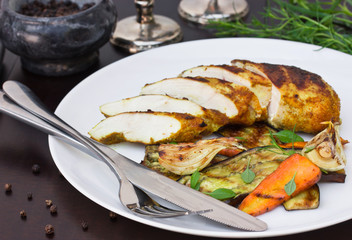 Spicy chicken and vegetables cooked on the grill