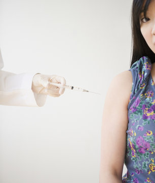 Korean woman receiving injection