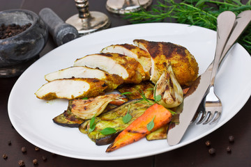 Chicken breast in spices and grilled young vegetables